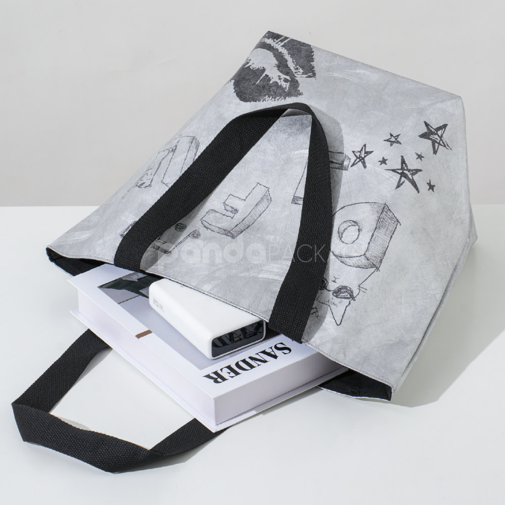 Eco-friendly gray tote paper bag with illustrated prints and black handles