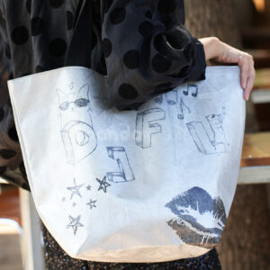 Eco-friendly gray tote paper bag with illustrated prints and black handles