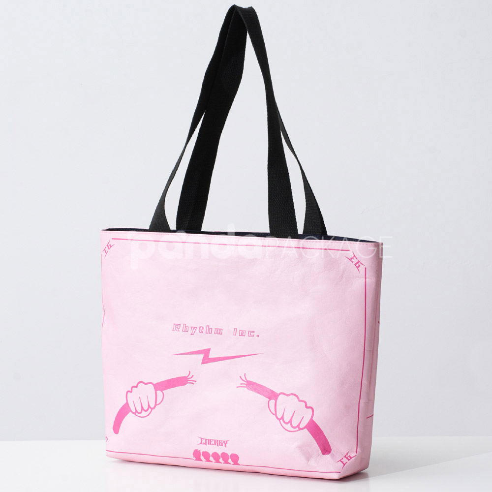 Pink paper tote bag with graffiti-style print and black handles