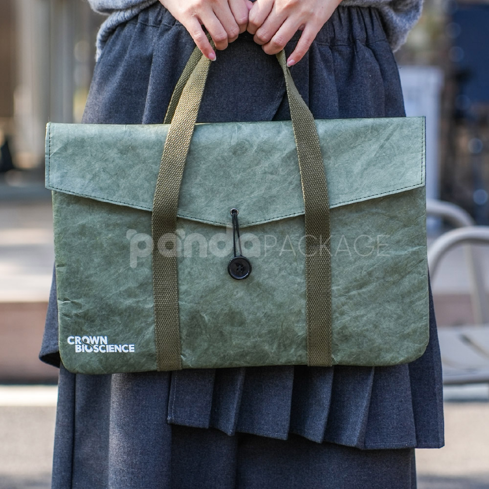 Green kraft paper tote bag with button string closure