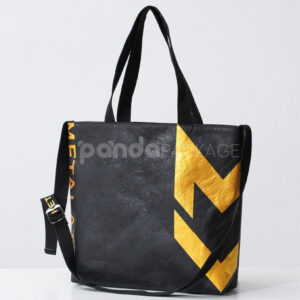 Black paper tote bag with metallic gold lightning graphic