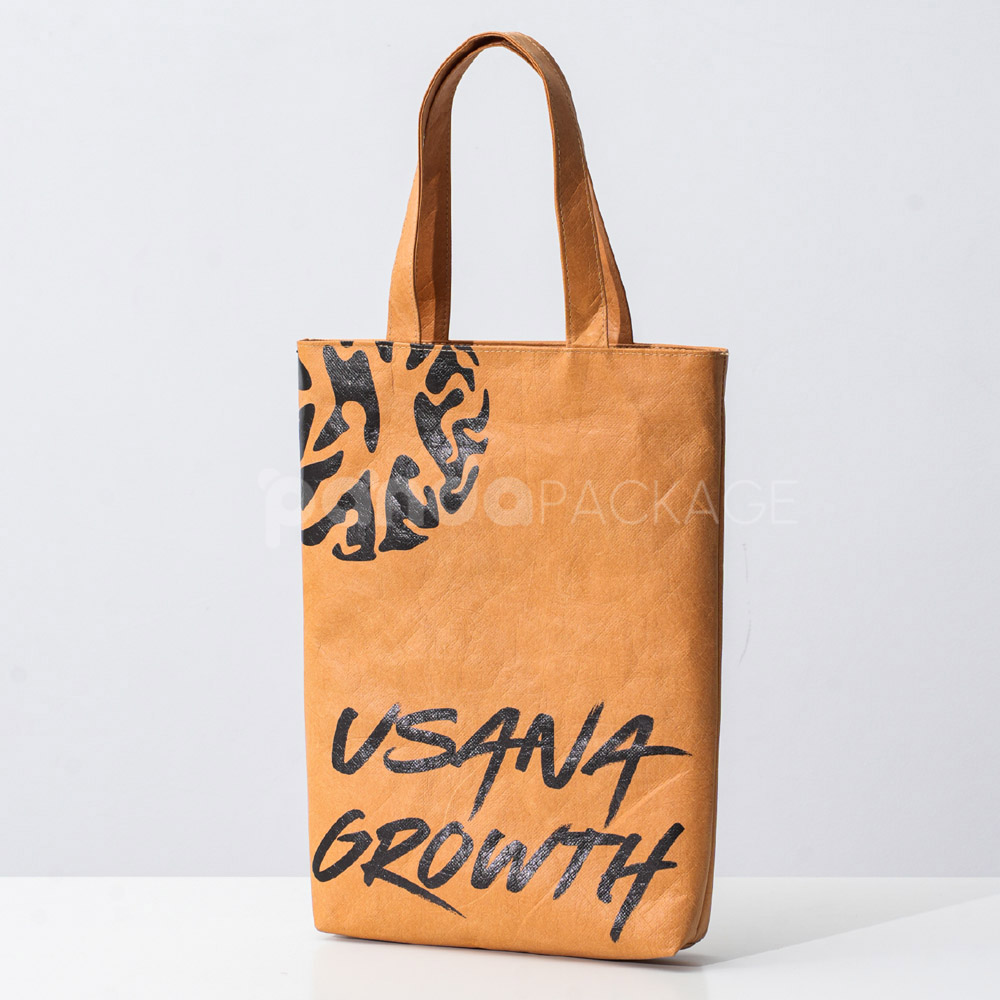 Eco-friendly kraft paper bag with flat handles and graphic design