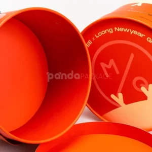 Custom orange round rigid box with lid and handle strap for luxury packaging