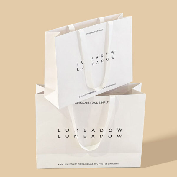 Elegant White Apparel Shopping Bag with Minimalist Logo Design