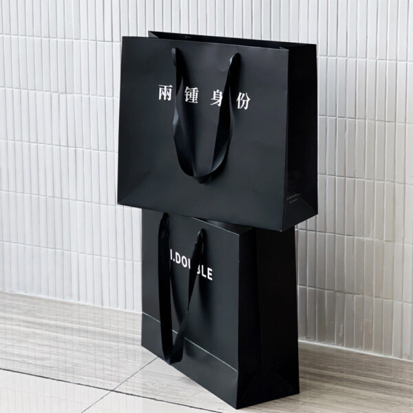 Black Apparel Shopping Bag with Elegant Minimalist Logo Design