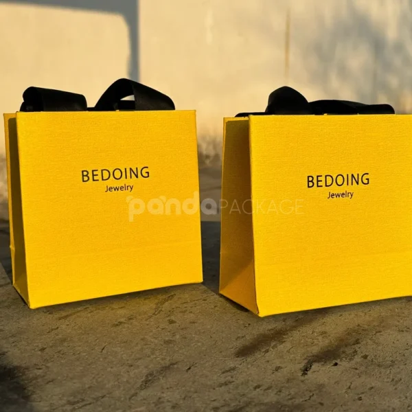 Vibrant Yellow Textured Paper Bag with Ribbon Handles