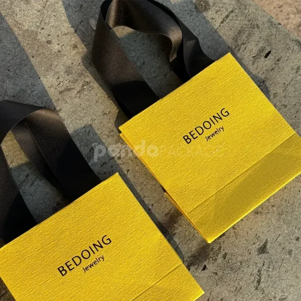 Vibrant Yellow Textured Paper Bag with Ribbon Handles