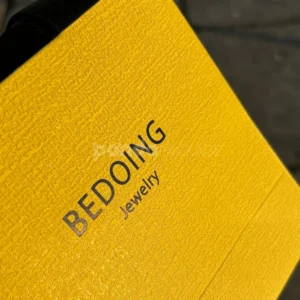 Luxury yellow textured paper bag with black ribbon handles