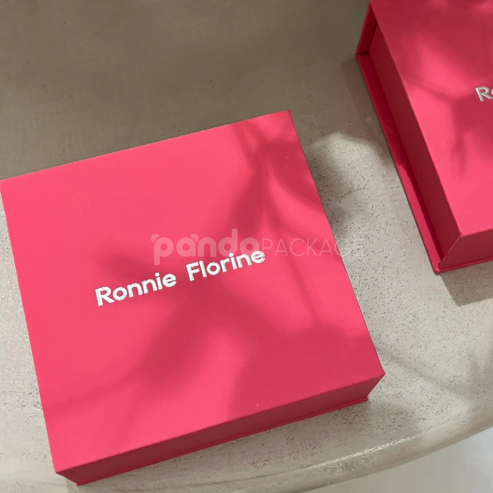 Luxury pink magnetic closure rigid box with silver foil logo