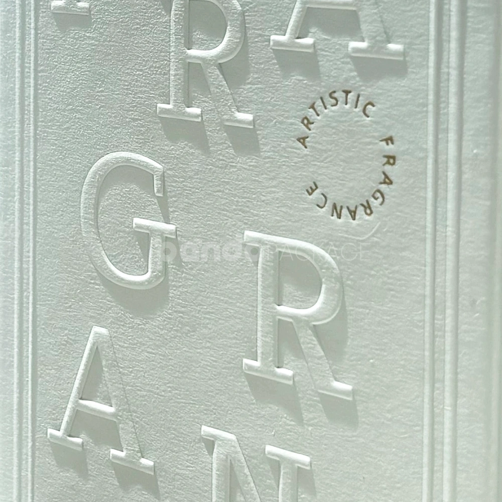 Ivory lift-off lid rigid box with paperboard insert and embossed