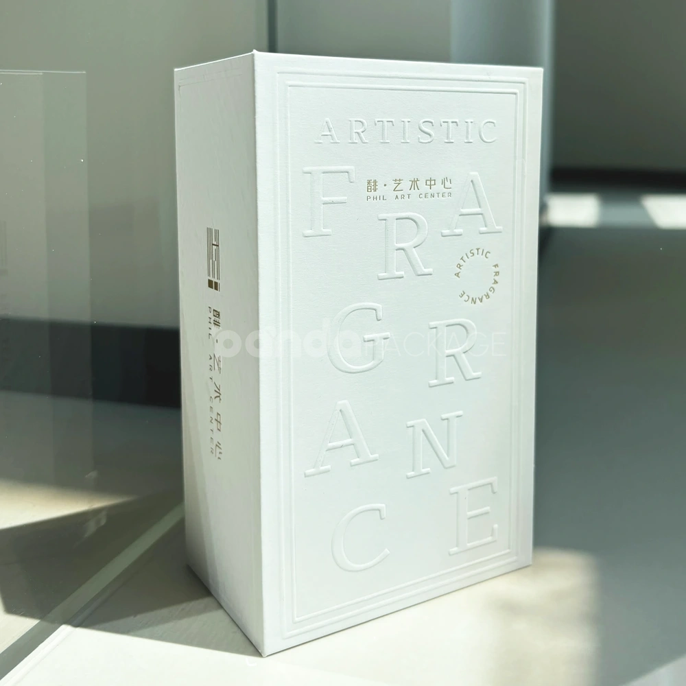Ivory lift-off lid rigid box with paperboard insert and embossed