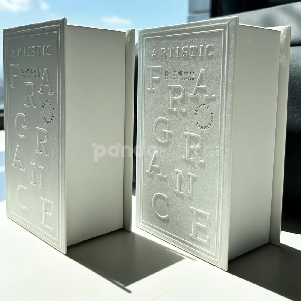 Ivory lift-off lid rigid box with paperboard insert and embossed