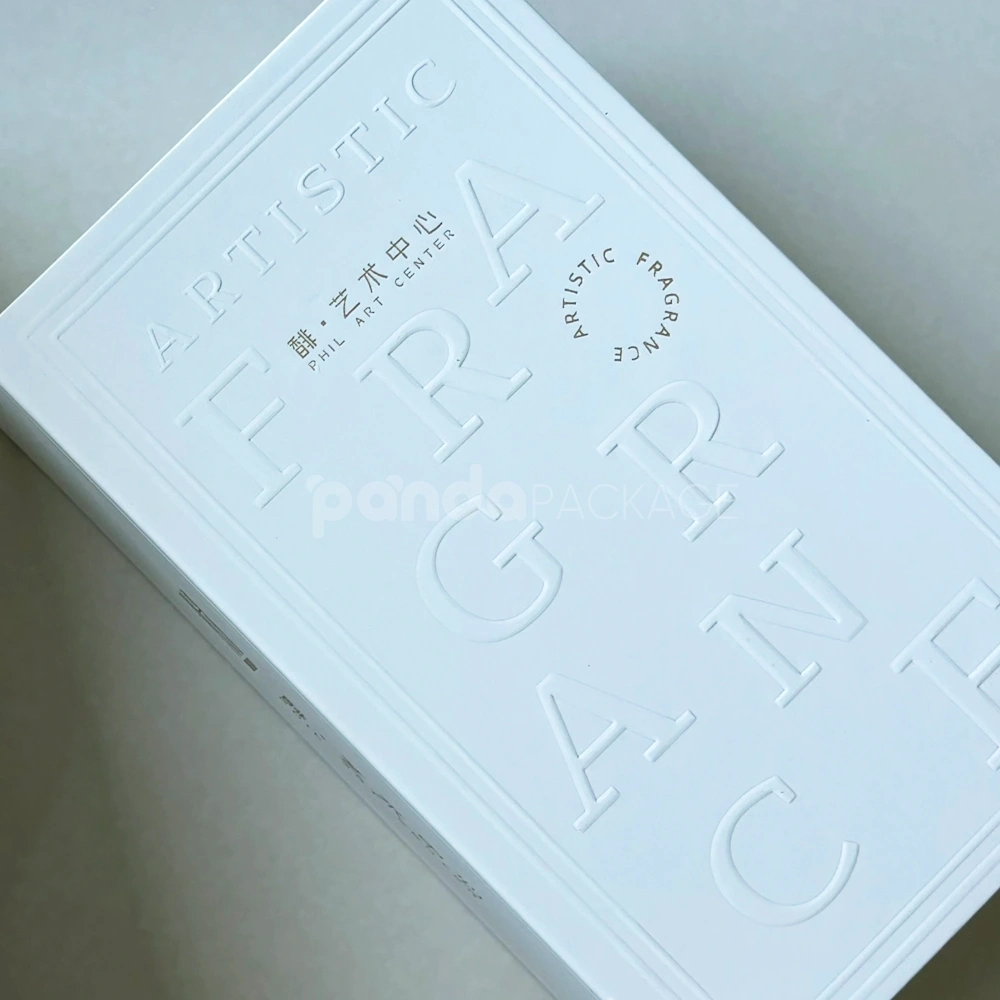 Ivory lift-off lid rigid box with paperboard insert and embossed