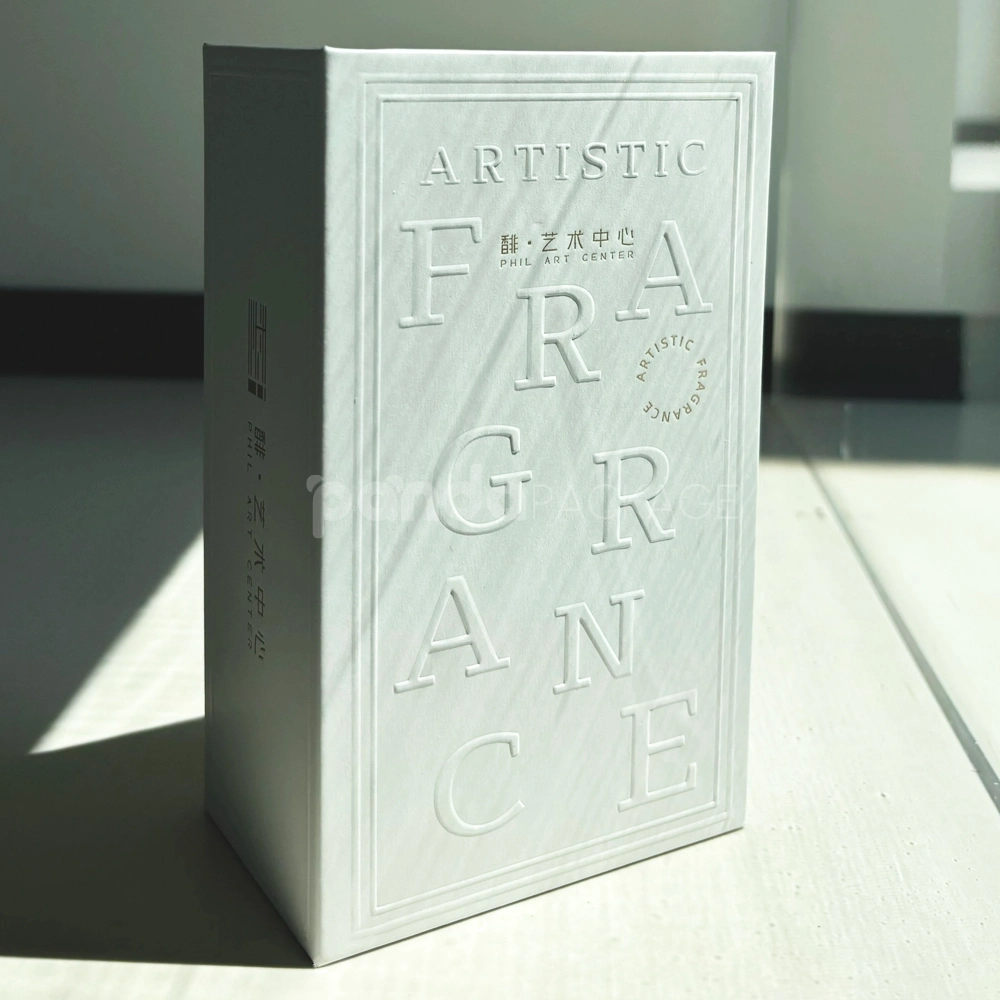 Ivory lift-off lid rigid box with paperboard insert and embossed