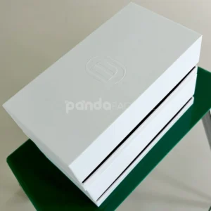 White lift-off rigid gift box with embossed logo and red accent