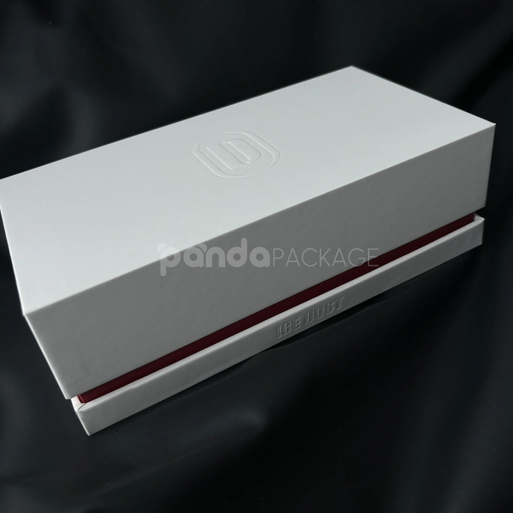 White lift-off rigid gift box with embossed logo and red accent