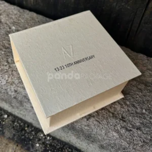 beige textured rigid flip lid box with embossed logo