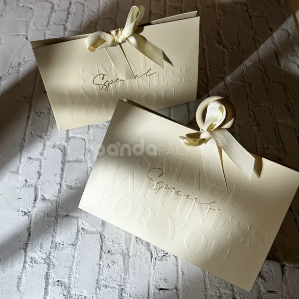 Elegant Cream Paper Gift Bag with Ribbon Handle