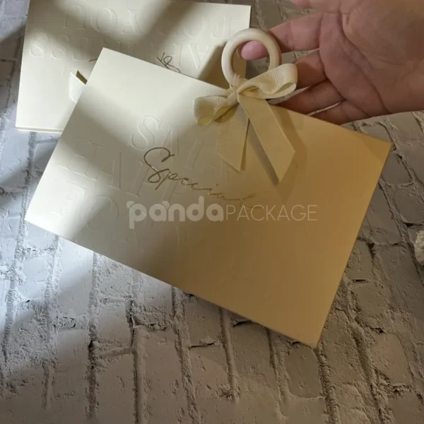Elegant Cream Paper Gift Bag with Ribbon Handle