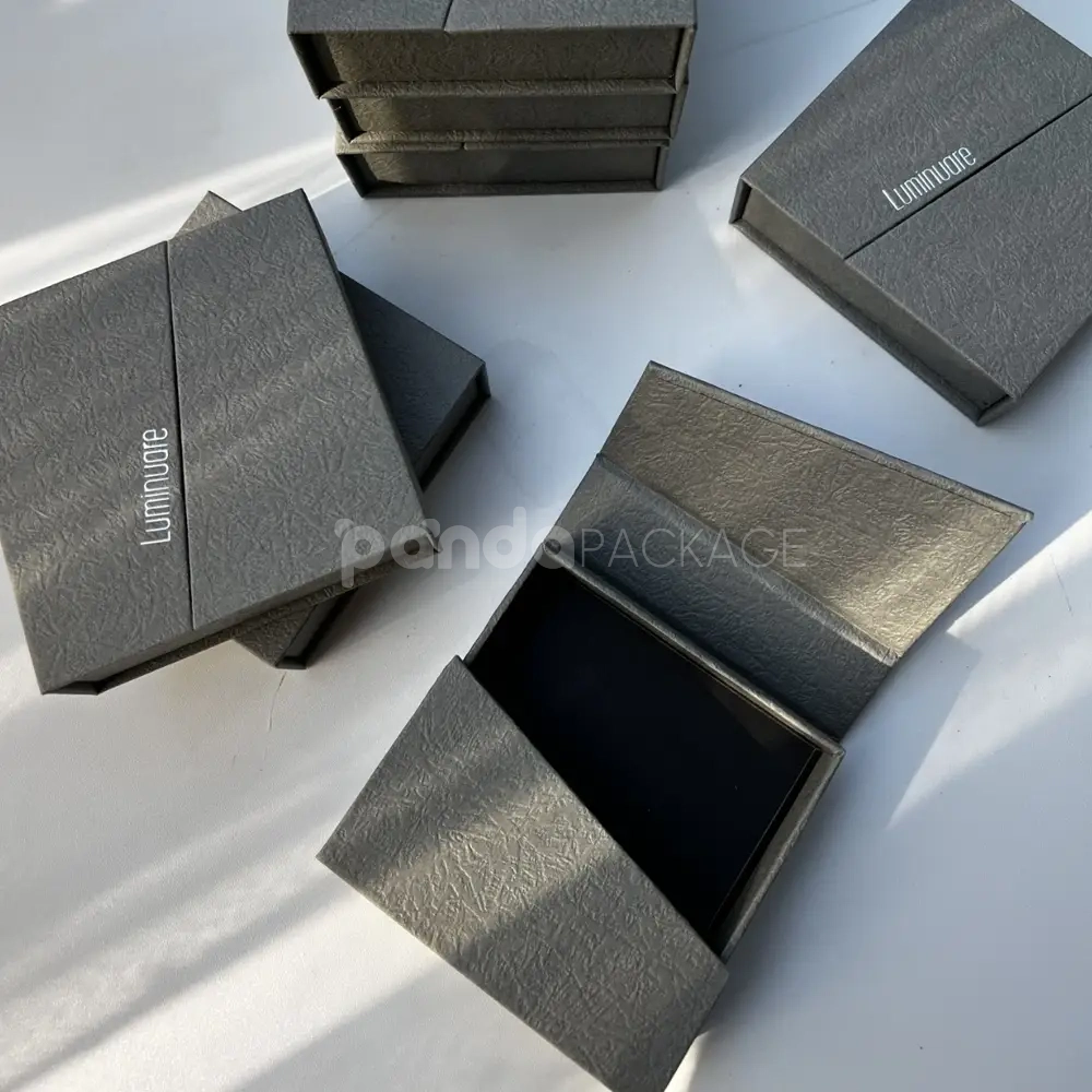 gray textured rigid flip lid box with silver foil stamping