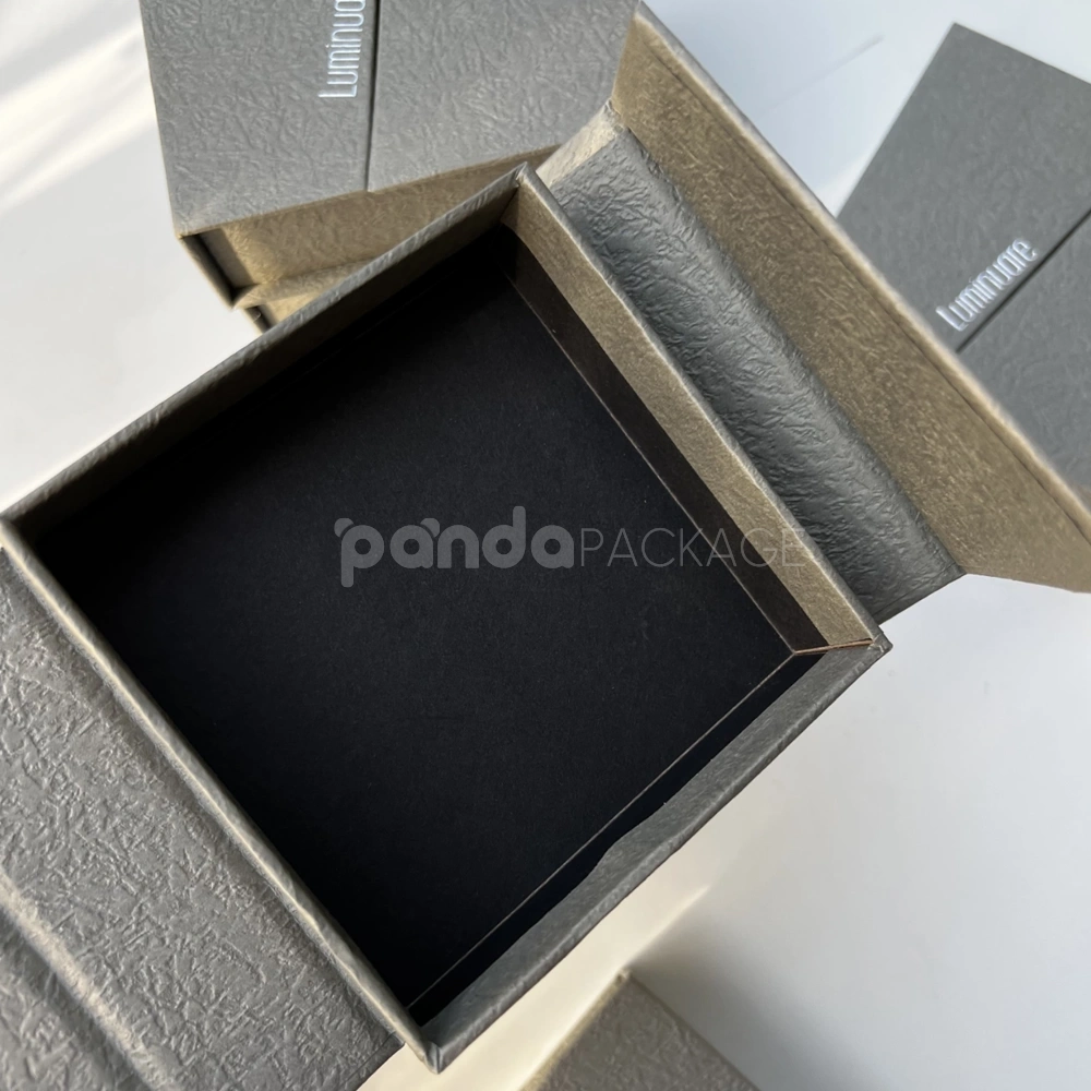 gray textured rigid flip lid box with silver foil stamping