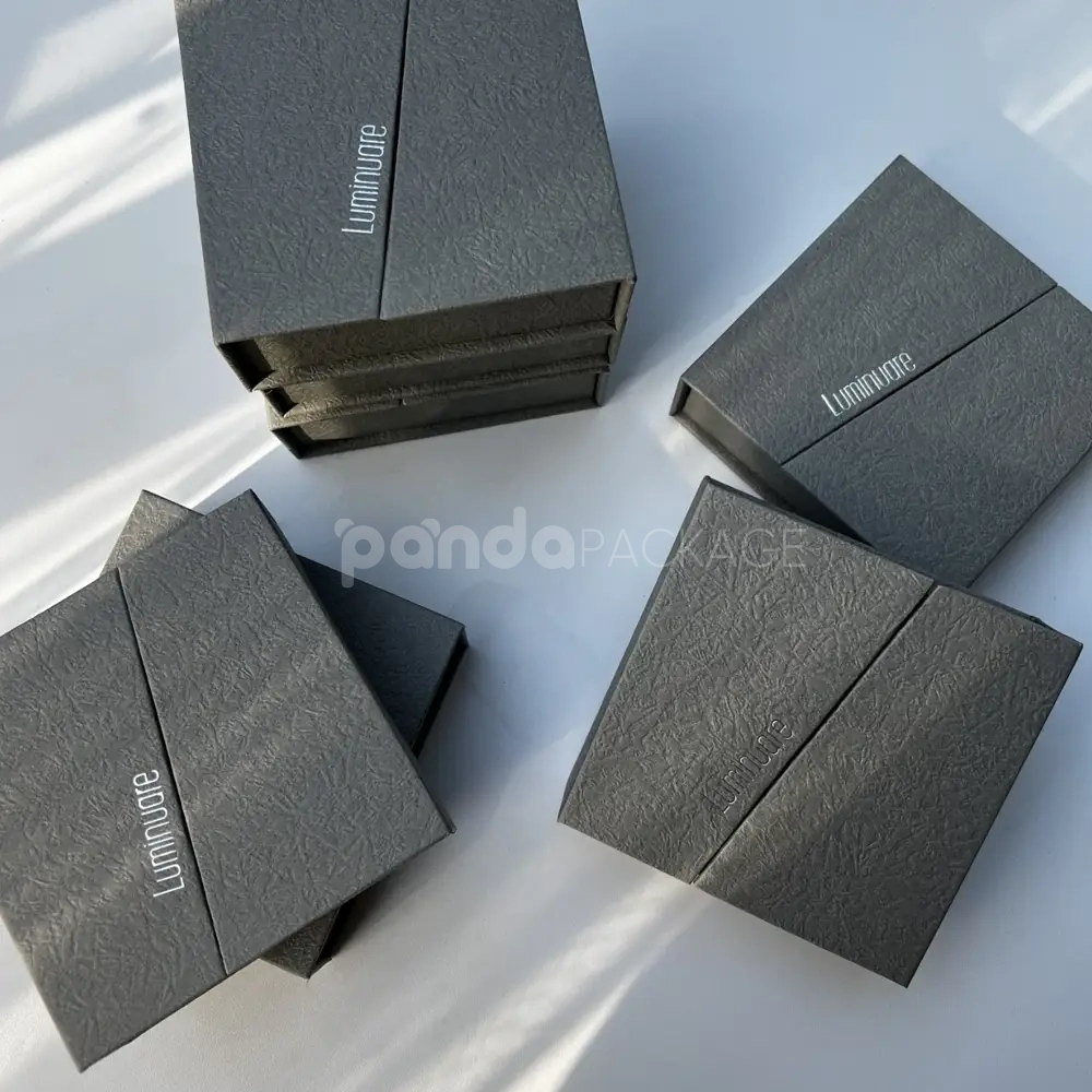 gray textured rigid flip lid box with silver foil stamping