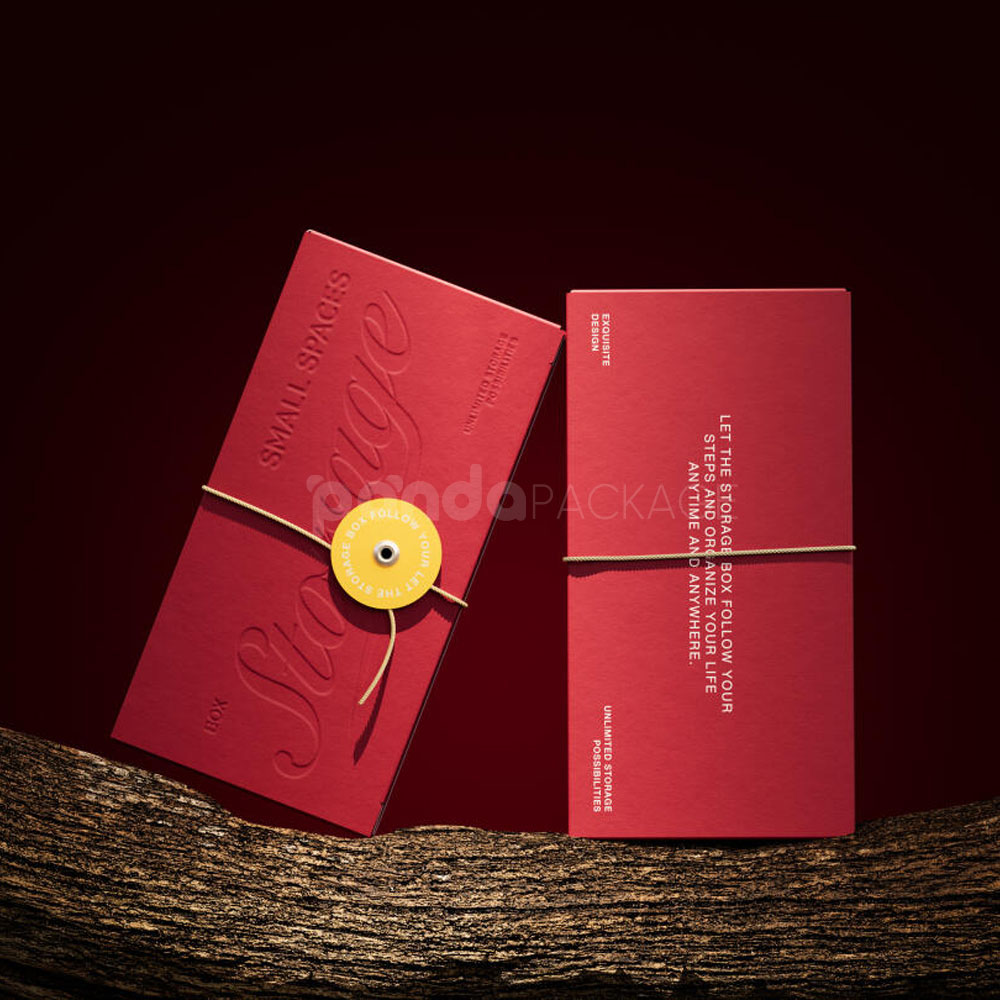 red triangle paperboard box with embossed logo and string tie closure