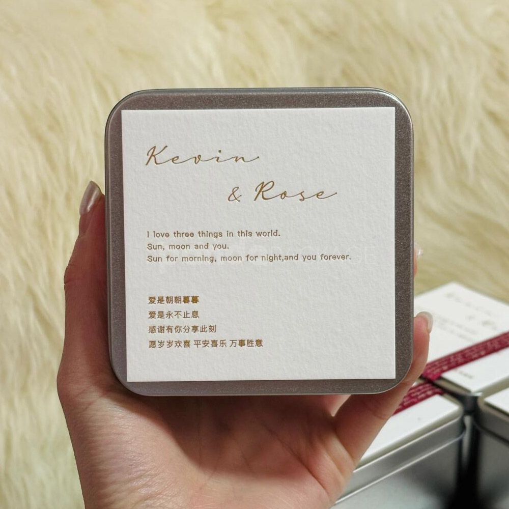 square silver tin box with decorative ribbon and customizable cover