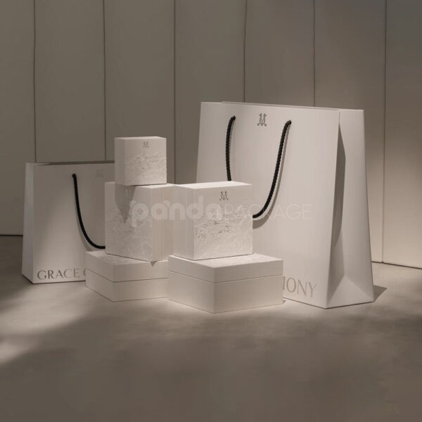 Elegant Embossed White Luxury Packaging Boxes for High-End Clothing