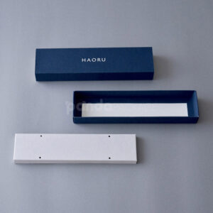 rectangular rigid slide box with textured surface and drawer lid