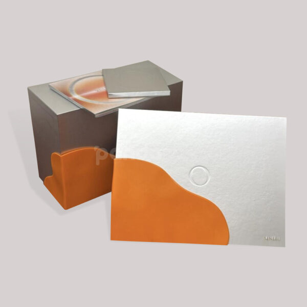 Modern Media Packaging with Minimalist Silver and Orange Design