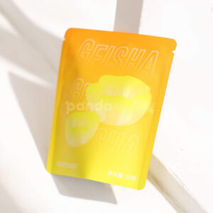 small gradient yellow–orange stand-up coffee pouch with matte surface