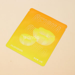 small gradient yellow–orange stand-up coffee pouch with matte surface