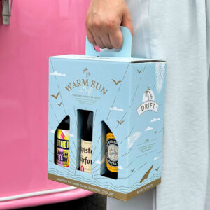 light blue six-bottle paperboard beer and liquor carrier box