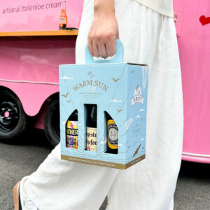 light blue six-bottle paperboard beer and liquor carrier box