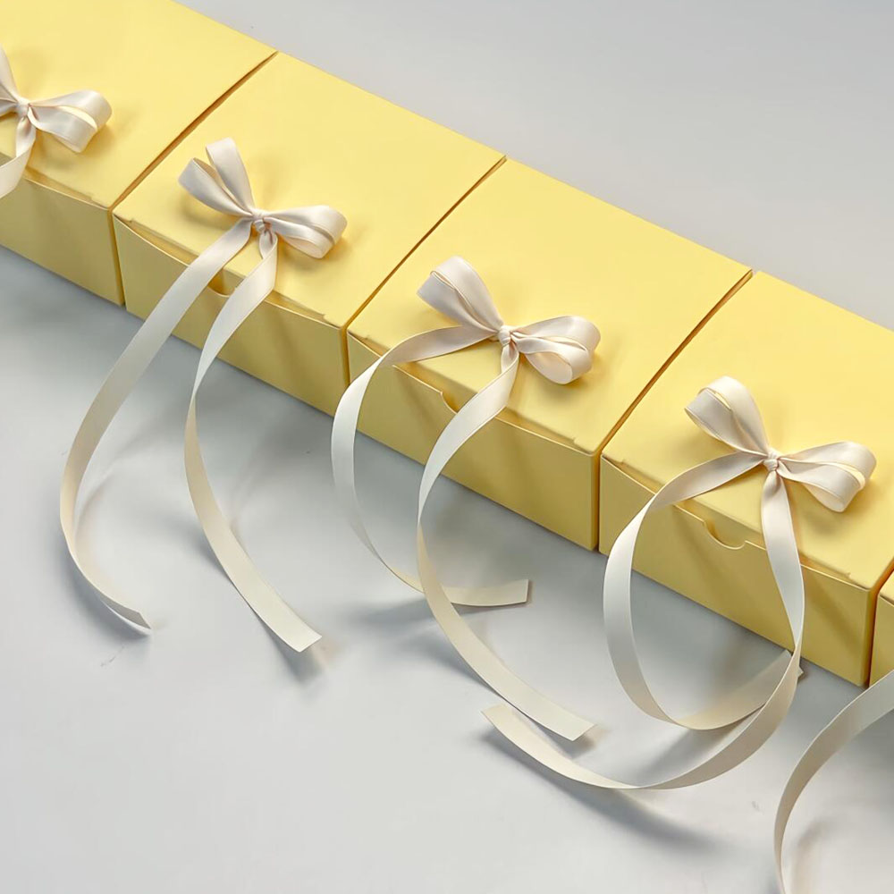 yellow paperboard gift box with satin ribbon for candy packaging
