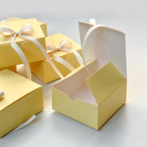 yellow paperboard gift box with satin ribbon for candy packaging