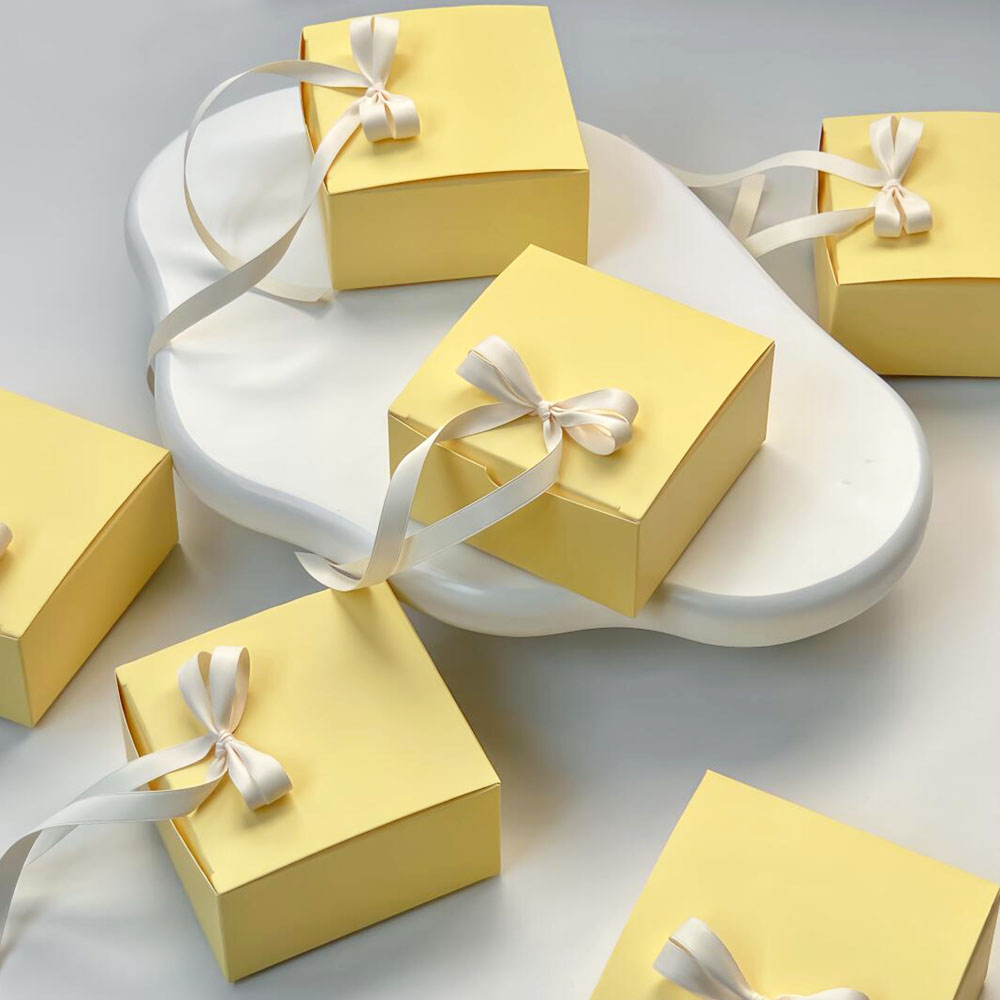yellow paperboard gift box with satin ribbon for candy packaging