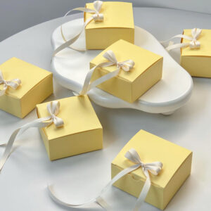 yellow paperboard gift box with satin ribbon for candy packaging