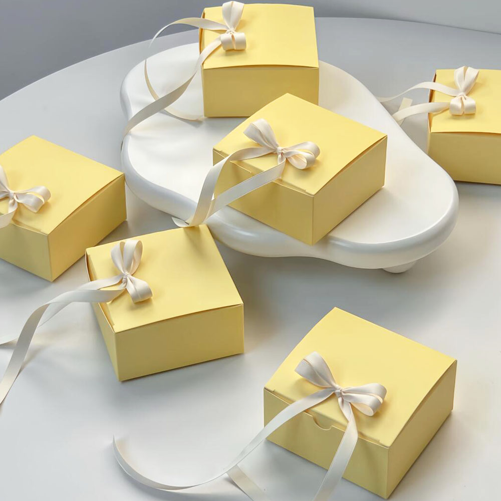 yellow paperboard gift box with satin ribbon for candy packaging