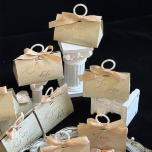 gold glitter candy favor box with pearl handle and ribbon