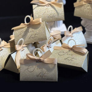 gold glitter candy favor box with pearl handle and ribbon