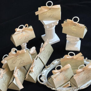 gold glitter candy favor box with pearl handle and ribbon