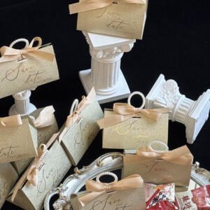 gold glitter candy favor box with pearl handle and ribbon