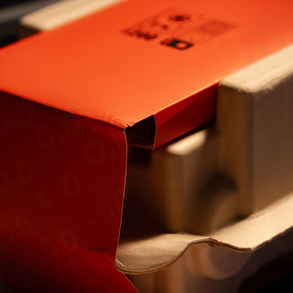 eco-friendly molded pulp electronic packaging with printed sleeve