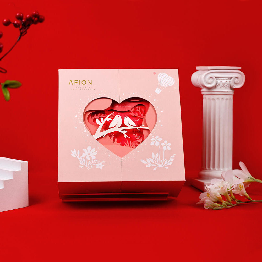 pink rigid gift box with heart shaped window and 3D paper cut design for luxury packaging