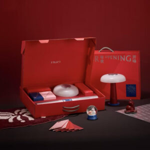 red rigid gift box with rope handle and silver foil stamping for festive holiday packaging