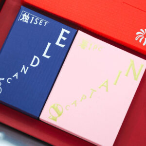 red rigid gift box with rope handle and silver foil stamping for festive holiday packaging