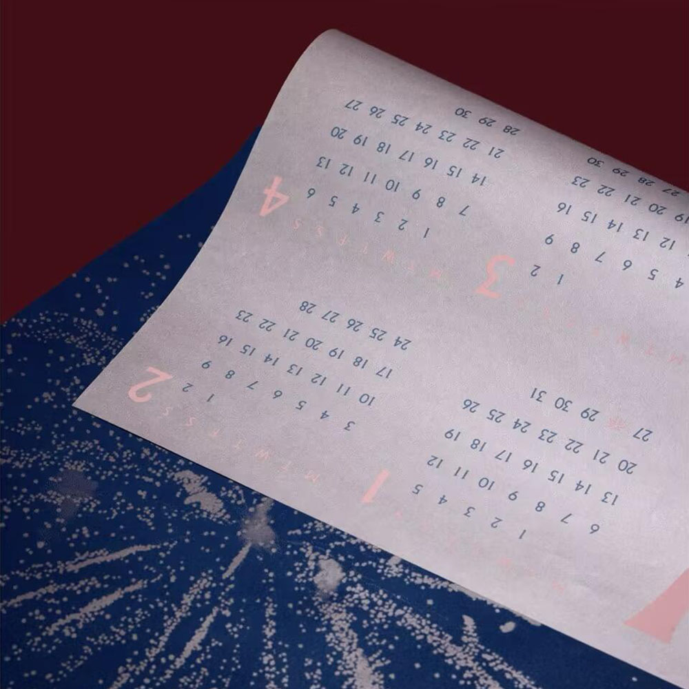 red rigid gift box with rope handle and silver foil stamping for festive holiday packaging