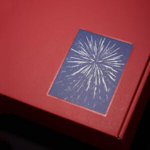 red rigid gift box with rope handle and silver foil stamping for festive holiday packaging